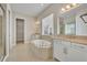 Main bathroom with soaking tub and walk-in shower at 14157 Creekbed Cir, Winter Garden, FL 34787