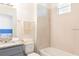 Clean bathroom with granite vanity, commode and a bathtub at 1788 Coriander Dr, Kissimmee, FL 34759