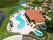 Aerial view of resort-style swimming pools and clubhouse with manicured grounds at 1788 Coriander Dr, Kissimmee, FL 34759