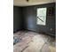 A bedroom with gray walls and damaged wood flooring at 3108 Lawrence St, Orlando, FL 32805