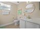 Bathroom with toilet, sink, and vanity at 3151 Riachuelo Ln, Kissimmee, FL 34744