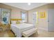 Bedroom with yellow accents and king-size bed at 3151 Riachuelo Ln, Kissimmee, FL 34744