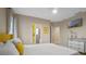 Bedroom with yellow accents and king bed at 3151 Riachuelo Ln, Kissimmee, FL 34744