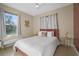 Bedroom with window, bed, and side table at 3151 Riachuelo Ln, Kissimmee, FL 34744