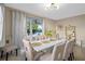 Dining room with lake view and white table at 3151 Riachuelo Ln, Kissimmee, FL 34744