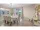 Dining room with lake view and white table at 3151 Riachuelo Ln, Kissimmee, FL 34744