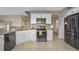 Modern kitchen with stainless steel appliances and breakfast bar at 3151 Riachuelo Ln, Kissimmee, FL 34744