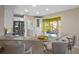 Kitchen with white cabinets, granite counters and breakfast bar at 3151 Riachuelo Ln, Kissimmee, FL 34744