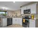 Modern kitchen with stainless steel appliances at 3151 Riachuelo Ln, Kissimmee, FL 34744