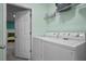 Laundry room with washer, dryer, and storage at 3151 Riachuelo Ln, Kissimmee, FL 34744
