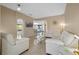 Living room with white sofas and large TV at 3151 Riachuelo Ln, Kissimmee, FL 34744