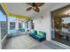 Relaxing screened porch with seating and ceiling fan at 3151 Riachuelo Ln, Kissimmee, FL 34744