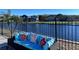 Backyard patio featuring outdoor seating with decorative pillows and a view of the lake at 3301 Buckingham Way, St Cloud, FL 34772