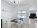 Charming dining area with stylish lighting, built-in seating, and a view of the pool at 3301 Buckingham Way, St Cloud, FL 34772