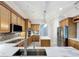 Modern kitchen boasts stainless steel appliances, an island, and mosaic tile backsplash at 3301 Buckingham Way, St Cloud, FL 34772