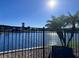 Scenic view of the lake, palm trees, and landscape from the backyard of this beautiful property at 3301 Buckingham Way, St Cloud, FL 34772