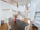 Open-concept living room with hardwood floors, grand staircase, and elegant decor at 3301 Buckingham Way, St Cloud, FL 34772