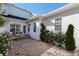 Picturesque courtyard with brick pavers, lovely plantings, and exterior access points at 4459 Twinview Ln, Orlando, FL 32814