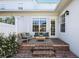 This cozy patio is perfect for relaxation, featuring brick pavers, comfortable seating and manicured plantings at 4459 Twinview Ln, Orlando, FL 32814