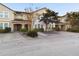 Charming townhome with a red tile roof, arched entryway and well-maintained landscaping at 4775 Terrasonesta Dr, Davenport, FL 33837