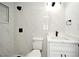 Modern bathroom featuring a walk-in shower, white marble tiling, and sleek fixtures at 5255 Seminole Ave, Winter Park, FL 32792