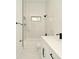 Modern bathroom with marble tile, sleek vanity, and contrasting black hardware accents at 5255 Seminole Ave, Winter Park, FL 32792