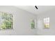 Bright bedroom with three large windows providing plenty of natural light at 5255 Seminole Ave, Winter Park, FL 32792