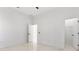 Minimalist bedroom with white walls, tile floors and natural light at 5255 Seminole Ave, Winter Park, FL 32792