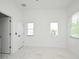 Bright bedroom with elegant marble floors and plenty of natural light from windows at 5255 Seminole Ave, Winter Park, FL 32792