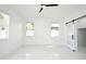 Spacious bedroom featuring bright, natural light, white walls and marble floors at 5255 Seminole Ave, Winter Park, FL 32792