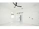 Bright, white bedroom featuring a ceiling fan, marble floors, and a sliding closet door at 5255 Seminole Ave, Winter Park, FL 32792