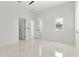 Spacious bedroom with bright white marble floors and ample lighting at 5255 Seminole Ave, Winter Park, FL 32792