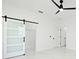 Bright bedroom features white walls, marble floors, a ceiling fan, and a closet with a sliding door at 5255 Seminole Ave, Winter Park, FL 32792
