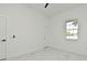 Bright bedroom featuring marble floors, fresh paint, a modern window and an interior door at 5255 Seminole Ave, Winter Park, FL 32792