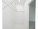 Walk-in closet features white walls, marble floors, and metal shelving at 5255 Seminole Ave, Winter Park, FL 32792