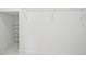Walk-in closet features white walls, neutral floors, and metal shelving at 5255 Seminole Ave, Winter Park, FL 32792