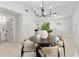 Bright and airy dining room area with a round table, modern light fixture, and an open layout at 5255 Seminole Ave, Winter Park, FL 32792