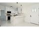 Beautiful kitchen featuring modern white marble countertops, sleek appliances, and ample cabinet space at 5255 Seminole Ave, Winter Park, FL 32792