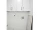 Bright laundry room with new white cabinets, plumbing hookups, and sleek design at 5255 Seminole Ave, Winter Park, FL 32792