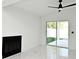 Bright living room with marble floors and a modern ceiling fan at 5255 Seminole Ave, Winter Park, FL 32792