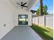 Covered patio with a ceiling fan and sliding glass doors, overlooking the backyard at 5255 Seminole Ave, Winter Park, FL 32792