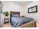 Bedroom featuring a rustic wood bed frame and coordinating decor at 538 Stowers Dr, New Smyrna Beach, FL 32168