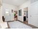 Inviting entryway with patterned rug, decorative coat rack, and convenient access to bathroom and living spaces at 538 Stowers Dr, New Smyrna Beach, FL 32168