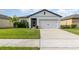Single-story home with attached garage and well-manicured lawn at 538 Stowers Dr, New Smyrna Beach, FL 32168