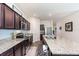 Granite countertops and stainless steel appliances accent this modern kitchen with ample counter space at 538 Stowers Dr, New Smyrna Beach, FL 32168