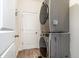 Laundry room featuring a stacked washer and dryer and a white door at 538 Stowers Dr, New Smyrna Beach, FL 32168