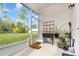 Screened porch with backyard view and potted plants at 538 Stowers Dr, New Smyrna Beach, FL 32168
