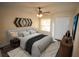 Bright bedroom with a king-size bed, ceiling fan, and large closet at 7524 Seurate #12208 St # 12208, Orlando, FL 32819