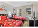 Charming bedroom with two twin beds and playful decor, creating a fun and inviting space for  at 8443 Crystal Cove Loop, Kissimmee, FL 34747