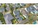 Aerial view of the home and neighborhood showcasing a backyard pool, solar panels and mature trees at 1131 Fern Ave, Orlando, FL 32814